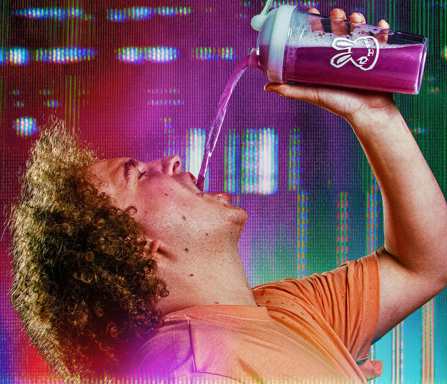 White man with brown curly hair pouring sneak energy drink into his mouth.